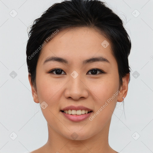 Joyful asian young-adult female with short  brown hair and brown eyes