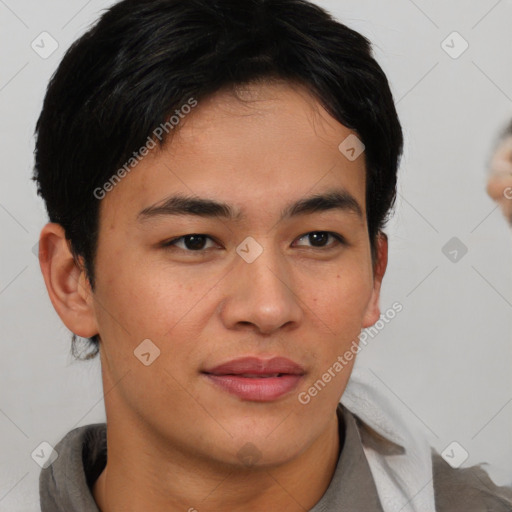Joyful asian young-adult male with short  brown hair and brown eyes