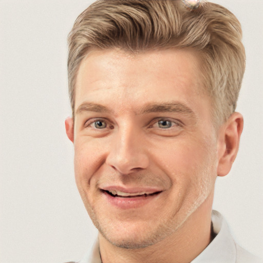 Joyful white adult male with short  brown hair and grey eyes