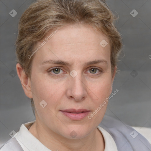 Joyful white adult female with short  brown hair and grey eyes