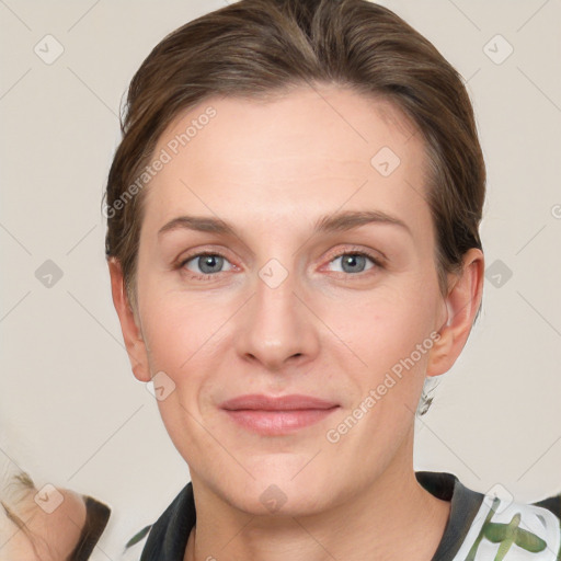 Joyful white adult female with medium  brown hair and grey eyes