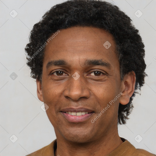 Joyful latino adult male with short  black hair and brown eyes