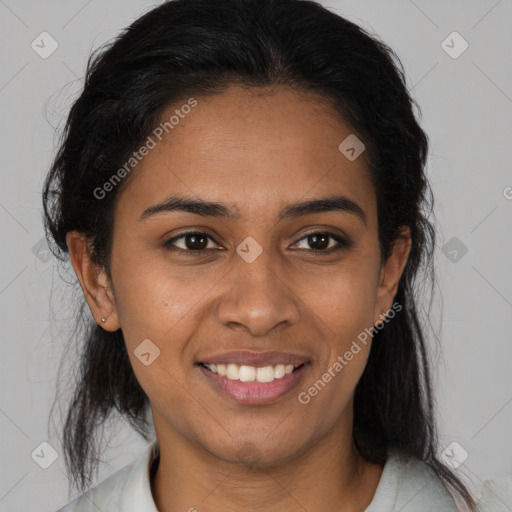 Joyful black young-adult female with medium  brown hair and brown eyes