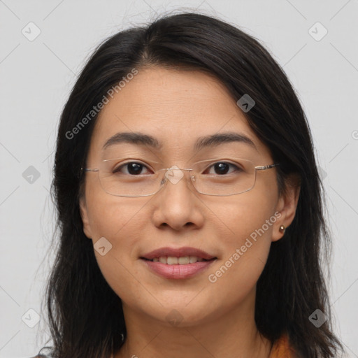 Joyful asian young-adult female with long  brown hair and brown eyes