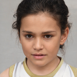 Joyful white child female with short  brown hair and brown eyes