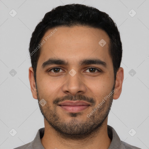 Joyful latino young-adult male with short  black hair and brown eyes