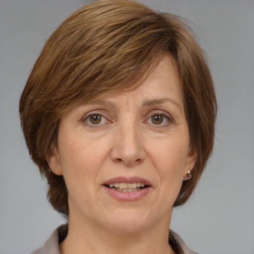 Joyful white adult female with medium  brown hair and grey eyes