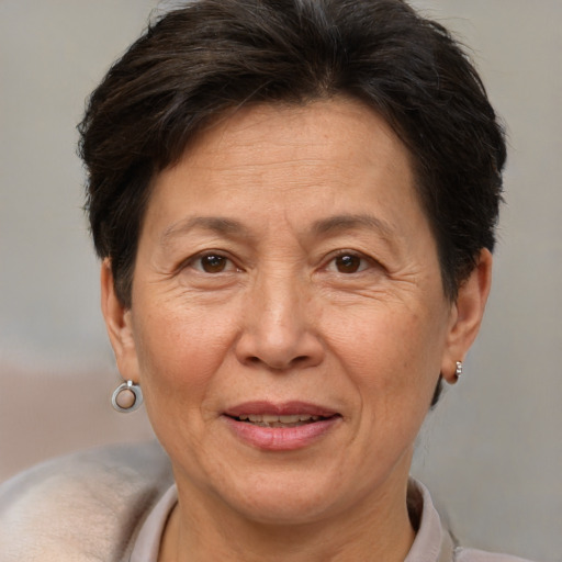 Joyful white middle-aged female with short  brown hair and brown eyes