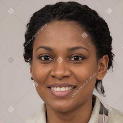 Joyful black young-adult female with medium  black hair and brown eyes