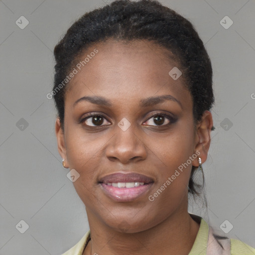 Joyful black young-adult female with short  brown hair and brown eyes