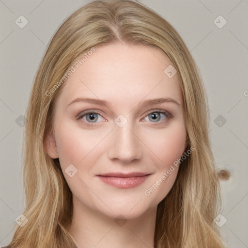 Joyful white young-adult female with long  brown hair and blue eyes