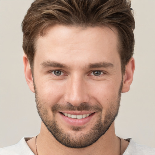 Joyful white young-adult male with short  brown hair and brown eyes