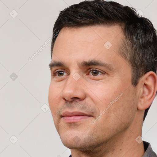 Joyful white adult male with short  brown hair and brown eyes