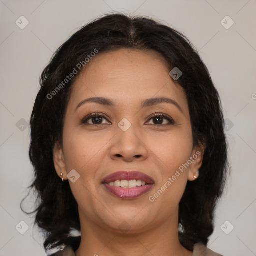 Joyful latino young-adult female with medium  brown hair and brown eyes