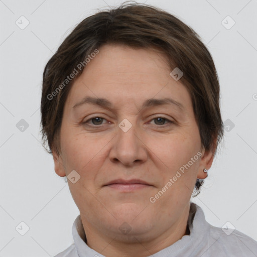 Joyful white adult female with short  brown hair and brown eyes