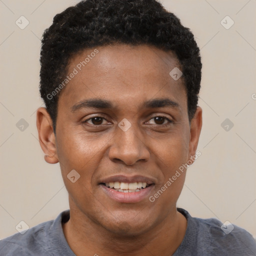 Joyful black young-adult male with short  black hair and brown eyes