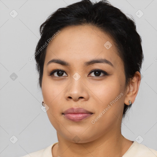 Joyful asian young-adult female with short  black hair and brown eyes