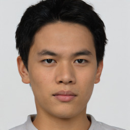 Neutral asian young-adult male with short  brown hair and brown eyes