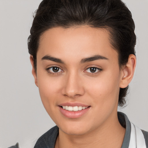 Joyful white young-adult female with medium  brown hair and brown eyes