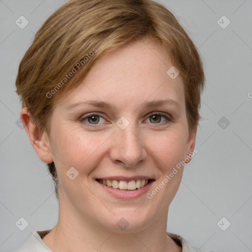 Joyful white young-adult female with short  brown hair and grey eyes