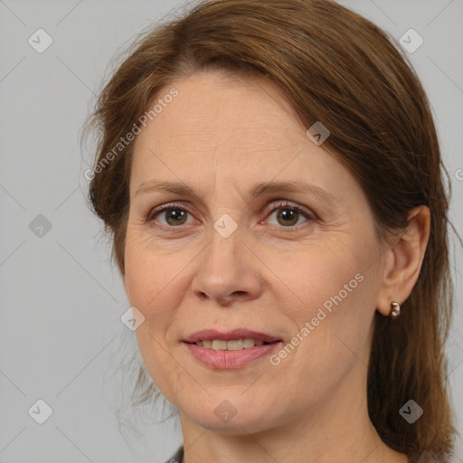 Joyful white adult female with medium  brown hair and brown eyes