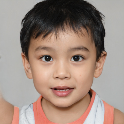 Joyful white child male with short  brown hair and brown eyes