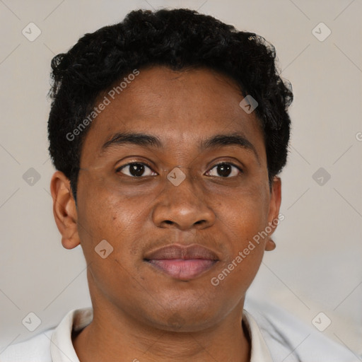 Joyful latino young-adult male with short  brown hair and brown eyes