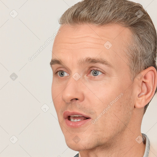 Joyful white adult male with short  brown hair and grey eyes