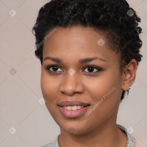 Joyful black young-adult female with short  brown hair and brown eyes