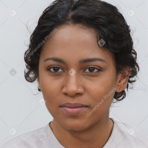 Joyful black young-adult female with medium  brown hair and brown eyes