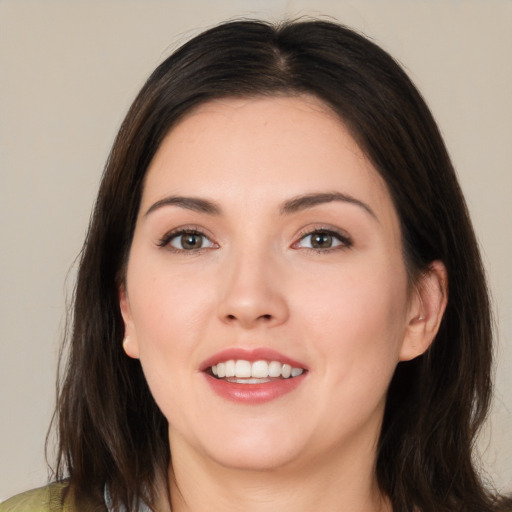 Joyful white young-adult female with medium  brown hair and brown eyes