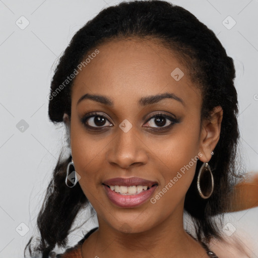 Joyful black young-adult female with long  black hair and brown eyes