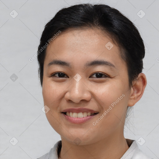 Joyful white young-adult female with short  brown hair and brown eyes