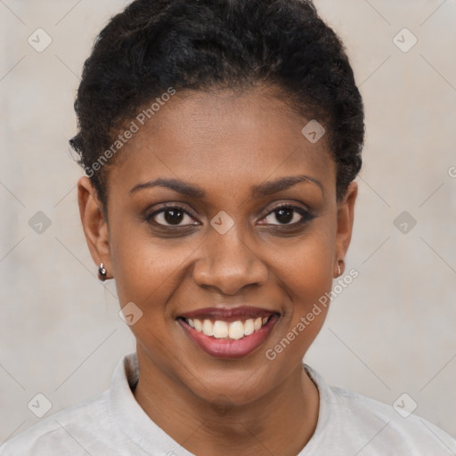 Joyful black young-adult female with short  brown hair and brown eyes