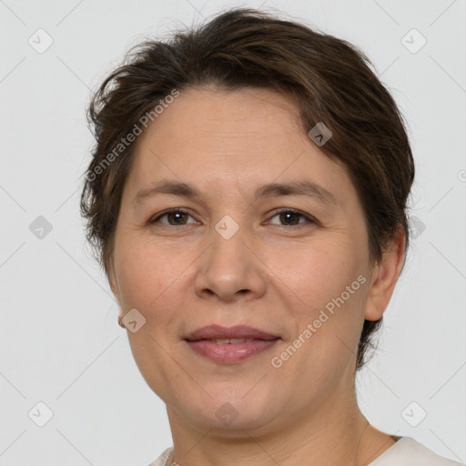 Joyful white adult female with short  brown hair and brown eyes