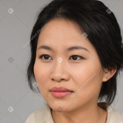 Joyful asian young-adult female with medium  black hair and brown eyes