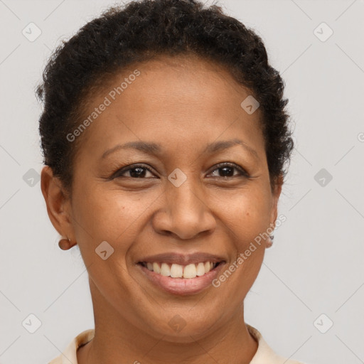 Joyful black adult female with short  brown hair and brown eyes