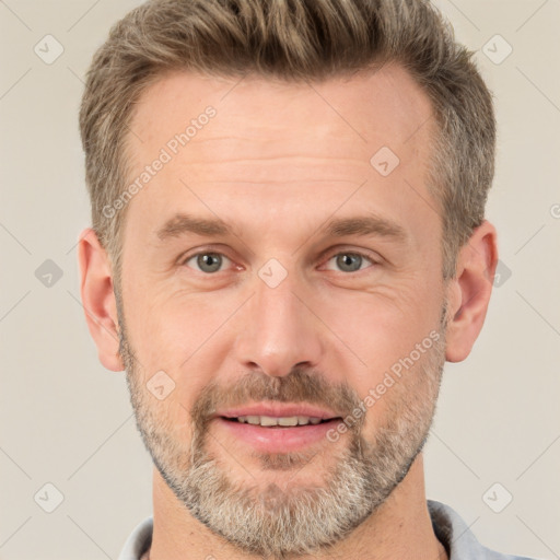 Joyful white adult male with short  brown hair and brown eyes