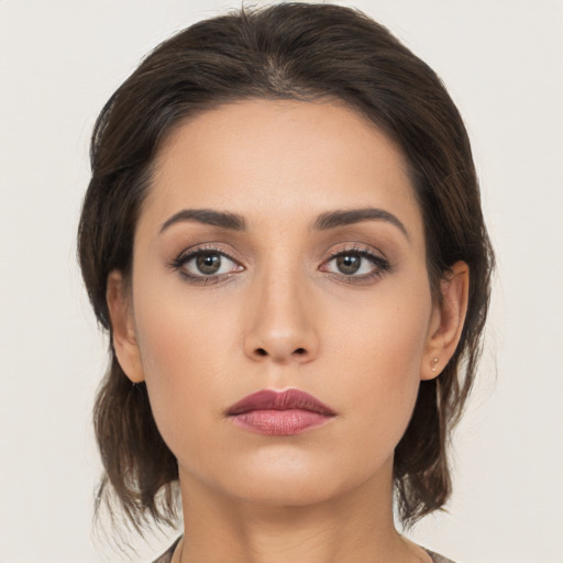 Neutral white young-adult female with medium  brown hair and brown eyes