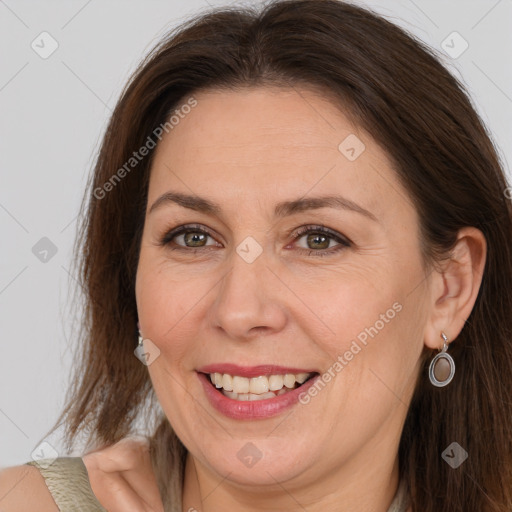 Joyful white adult female with medium  brown hair and brown eyes