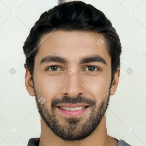 Joyful white young-adult male with short  black hair and brown eyes