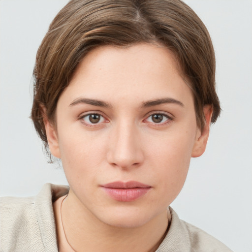 Neutral white young-adult female with short  brown hair and grey eyes