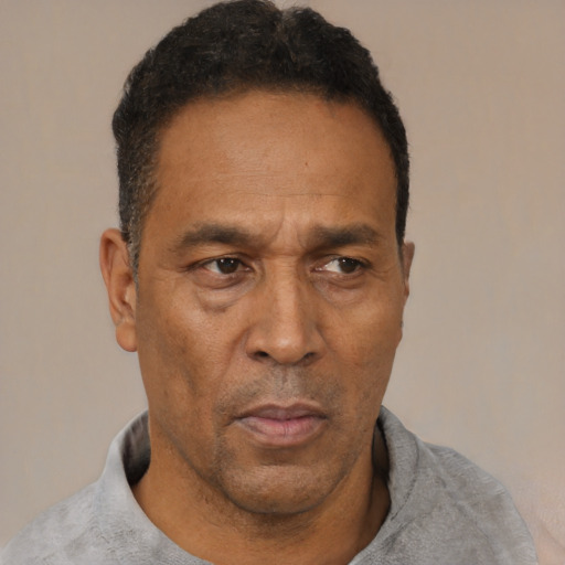 Neutral latino adult male with short  black hair and brown eyes
