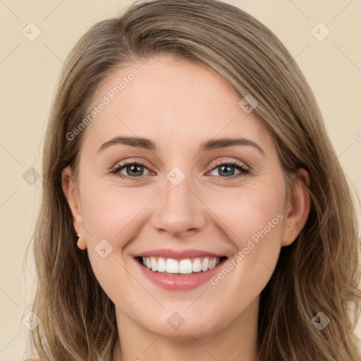 Joyful white young-adult female with long  brown hair and green eyes