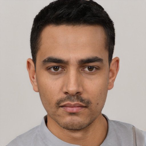 Neutral white young-adult male with short  black hair and brown eyes