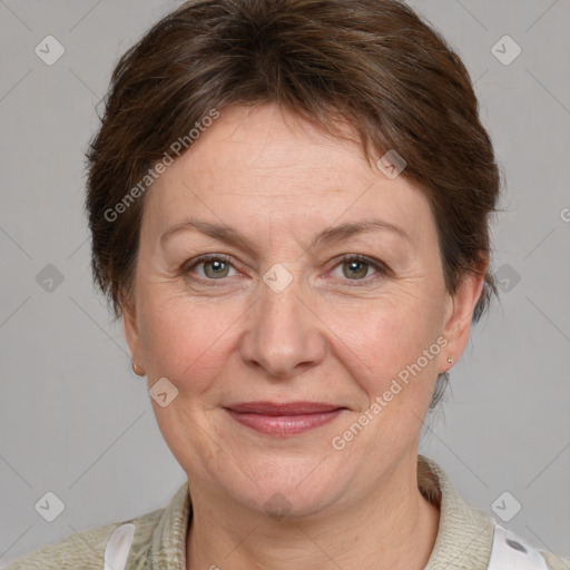 Joyful white adult female with medium  brown hair and grey eyes