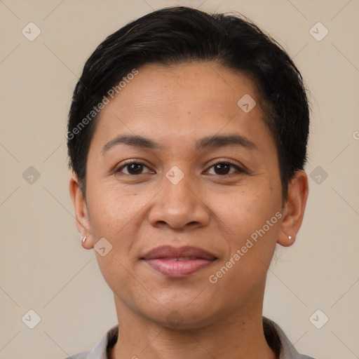 Joyful latino young-adult female with short  brown hair and brown eyes