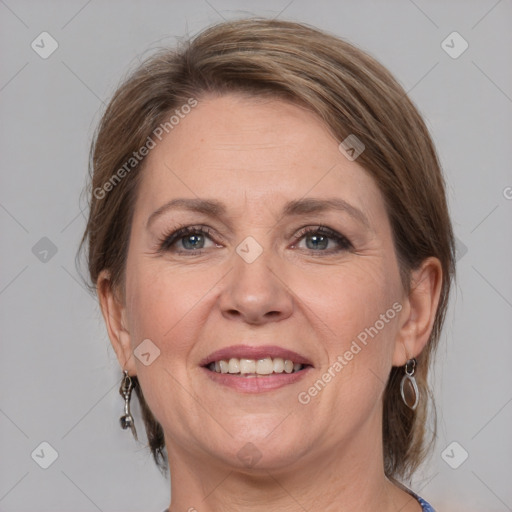 Joyful white adult female with medium  brown hair and grey eyes