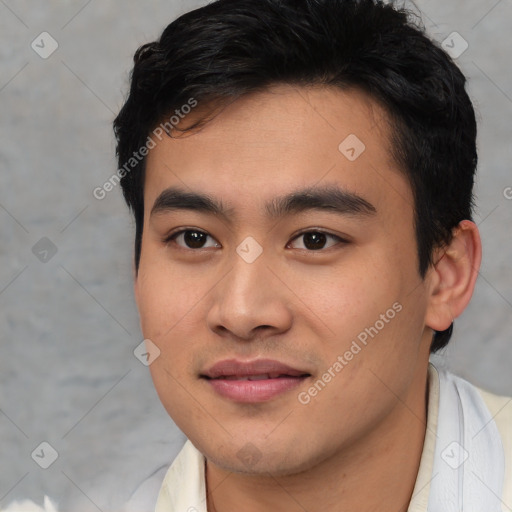 Joyful asian young-adult male with short  brown hair and brown eyes