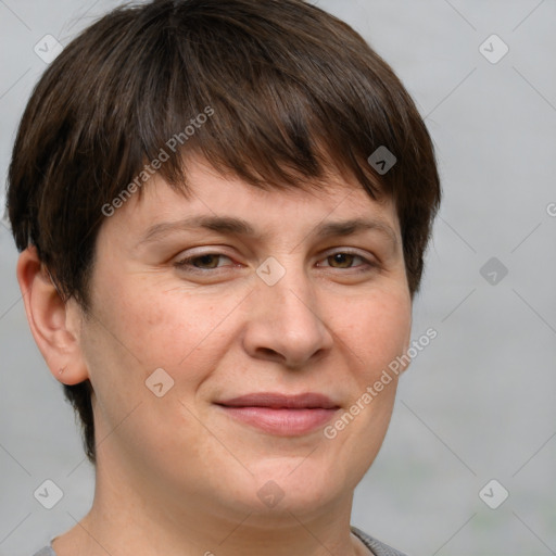 Joyful white adult female with short  brown hair and brown eyes